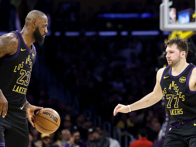 LOS ANGELES, CALIFORNIA - NOVEMBER 18: LeBron James #23 of the Los Angeles Lakers and Luka Doncic #77 in action against the Utah Jazz during the first half at Crypto.com Arena on November 18, 2025 in Los Angeles, California.