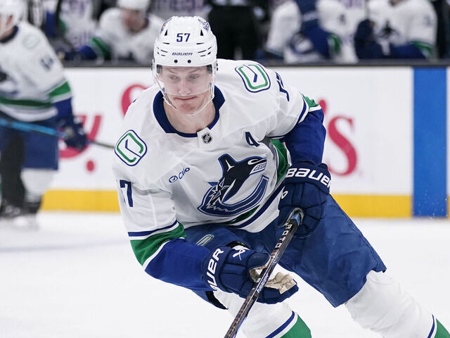 SALT LAKE CITY, UT - FEBRUARY 02: Tyler Myers #57 of the Vancouver Canucks controls the puck during an NHL game between the Vancouver Canucks and the Utah Mammoth on February 2, 2026 at the Delta Center in Salt Lake City, UT.