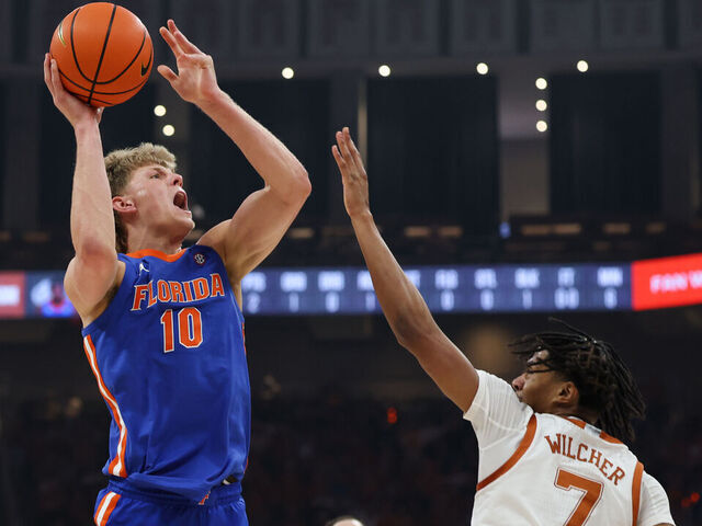 AUSTIN, TX - FEBRUARY 25: Forward Thomas Haugh #10 of the Florida Gators takes a shot over guard Simeon Wilcher #7 of the Texas Longhorns during the SEC college basketball game between Texas Longhorns and Florida Gators on February 25, 2026, at Moody Center in Austin, TX.