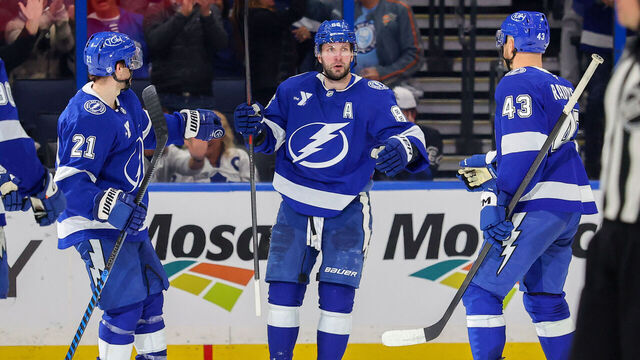 TAMPA, FL - FEBRUARY 25: Brayden Point #21 of the Tampa Bay Lightning celebrates his goal against the Toronto Maple Leafs with Nikita Kucherov #86 and Darren Raddysh #43 during the third period at the Benchmark International Arena on February 25, 2026 in Tampa, Florida.