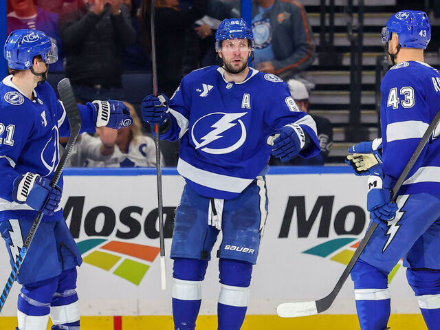 TAMPA, FL - FEBRUARY 25: Brayden Point #21 of the Tampa Bay Lightning celebrates his goal against the Toronto Maple Leafs with Nikita Kucherov #86 and Darren Raddysh #43 during the third period at the Benchmark International Arena on February 25, 2026 in Tampa, Florida.