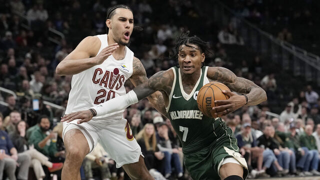 MILWAUKEE, WISCONSIN - FEBRUARY 25: Kevin Porter Jr. #7 of the Milwaukee Bucks dribbles the ball against Jaylon Tyson #20 of the Cleveland Cavaliers during the fourth quarter at Fiserv Forum on February 25, 2026 in Milwaukee, Wisconsin.