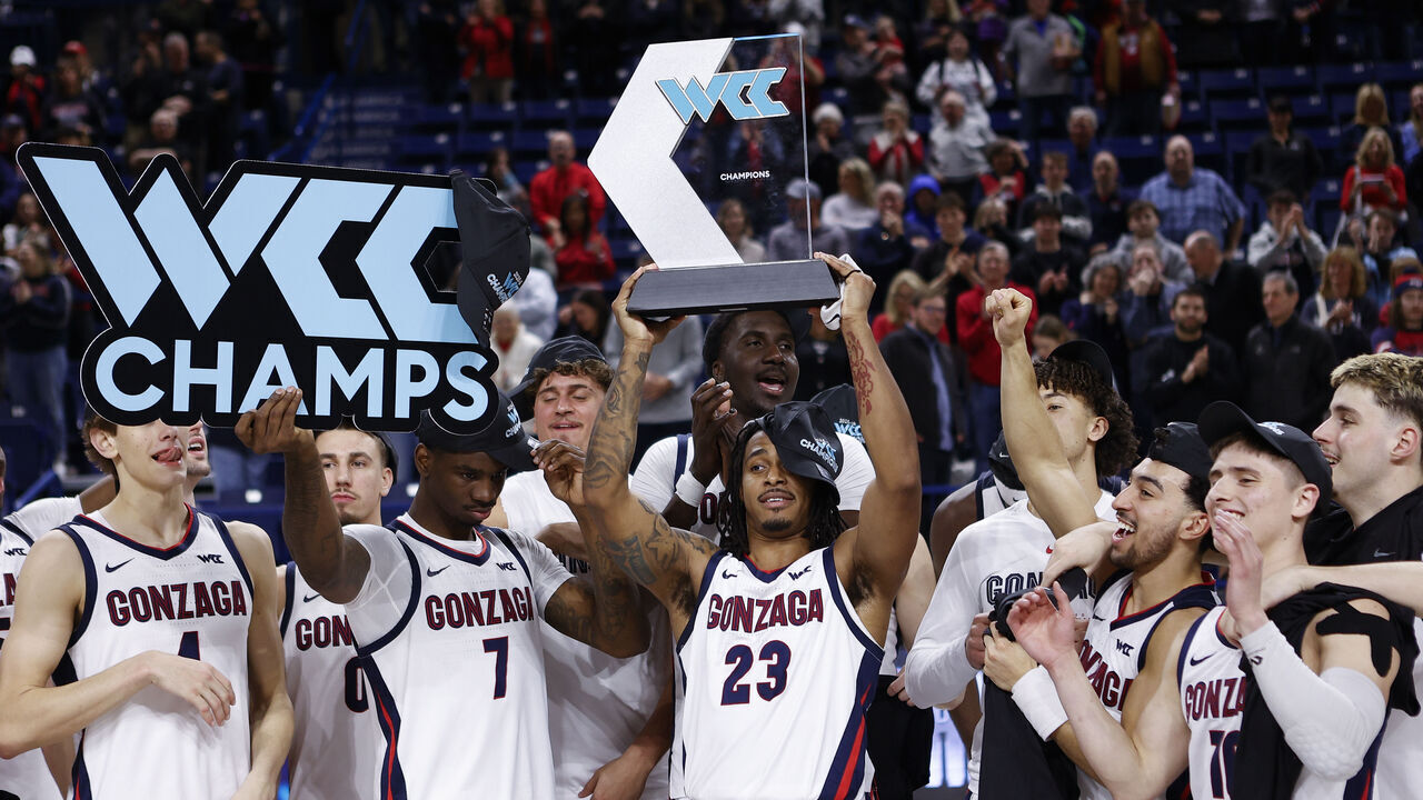 SPOKANE, WA - FEBRUARY 25: Gonzaga Bulldogs guard Adam Miller (23) holds up the West Coast Conference Champions trophy as his team celebrates after the game between the Portland Pilots and the Gonzaga Bulldogs at McCarthy Athletic Center in Spokane, WA, on February 25, 2026.