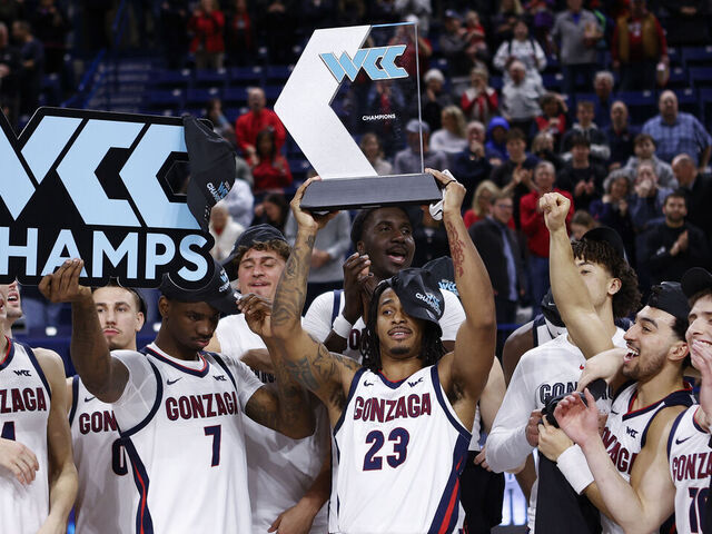 SPOKANE, WA - FEBRUARY 25: Gonzaga Bulldogs guard Adam Miller (23) holds up the West Coast Conference Champions trophy as his team celebrates after the game between the Portland Pilots and the Gonzaga Bulldogs at McCarthy Athletic Center in Spokane, WA, on February 25, 2026.