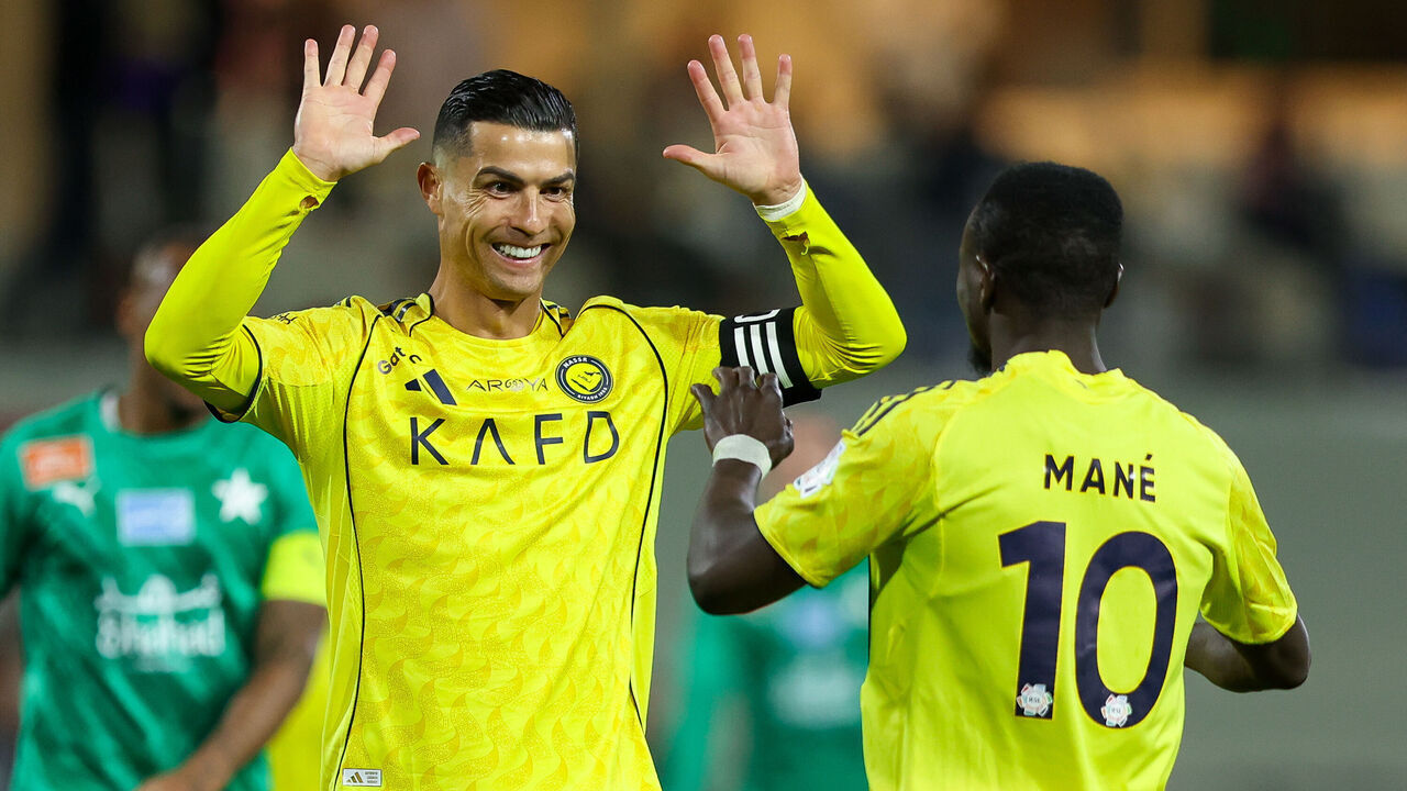 BURAYDAH, SAUDI ARABIA - FEBRUARY 25: Sadio Mane of Al Nassr celebrates with teammate Cristiano Ronaldo after scoring the 4th goal during the Saudi Pro League match between Al Najmah and Al Nassr at King Abdullah Sport City Stadium on February 25, 2026 in Buraydah, Saudi Arabia.