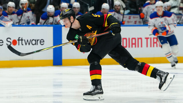 VANCOUVER, CANADA - JANUARY 17: Tyler Myers #57 of the Vancouver Canucks takes a shot during the third period of their NHL game against the Edmonton Oilers at Rogers Arena on January 17, 2026 in Vancouver, British Columbia, Canada.