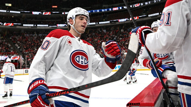 RALEIGH, NC - JANUARY 01: Left Wing Juraj Slafkovsky (20) of the Montreal Canadiens fist bumps teammates to celebrate scoring during the NHL game between the Montreal Canadiens and the Carolina Hurricanes on January 1, 2026 at Lenovo Center in Raleigh, North Carolina.