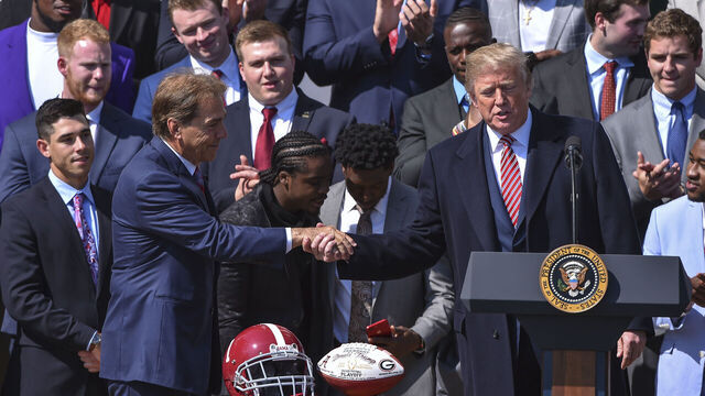 WASHINGTON, DC - APRIL 10: President Donald Trump shakes hands with Alabama coach Nick Saban during the event honoring members of the University of Alabama Crimson Tide, 2018 NCAA Football National Champions at the White House on April 10, 2018 in Washington, D.C.