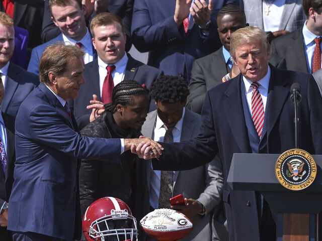 WASHINGTON, DC - APRIL 10: President Donald Trump shakes hands with Alabama coach Nick Saban during the event honoring members of the University of Alabama Crimson Tide, 2018 NCAA Football National Champions at the White House on April 10, 2018 in Washington, D.C.