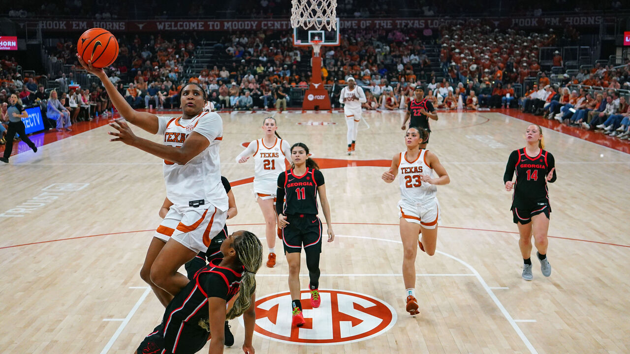 AUSTIN, TEXAS - FEBRUARY 26: Madison Booker #35 of the Texas Longhorns drives to the basket against Jocelyn Faison #1 of the Georgia Bulldogs during the second half at Moody Center on February 26, 2026 in Austin, Texas.