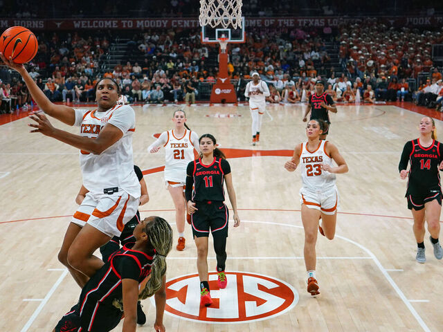 AUSTIN, TEXAS - FEBRUARY 26: Madison Booker #35 of the Texas Longhorns drives to the basket against Jocelyn Faison #1 of the Georgia Bulldogs during the second half at Moody Center on February 26, 2026 in Austin, Texas.