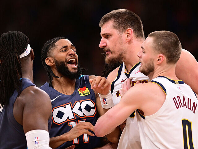 OKLAHOMA CITY, OKLAHOMA - FEBRUARY 27: Isaiah Joe #11 of the Oklahoma City Thunder gets in between Luguentz Dort #5 of the Oklahoma City Thunder and Nikola Jokic #15 of the Denver Nuggets during the second half at Paycom Center on February 27, 2026 in Oklahoma City, Oklahoma.