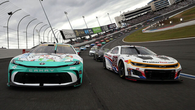 CONCORD, NORTH CAROLINA - OCTOBER 05: Tyler Reddick, driver of the #45 Jordan Brand Toyota, and Shane Van Gisbergen, driver of the #88 WeatherTech Chevrolet, lead the field on a pace lap prior to the NASCAR Cup Series Bank of America ROVAL 400 at Charlotte Motor Speedway on October 05, 2025 in Concord, North Carolina.