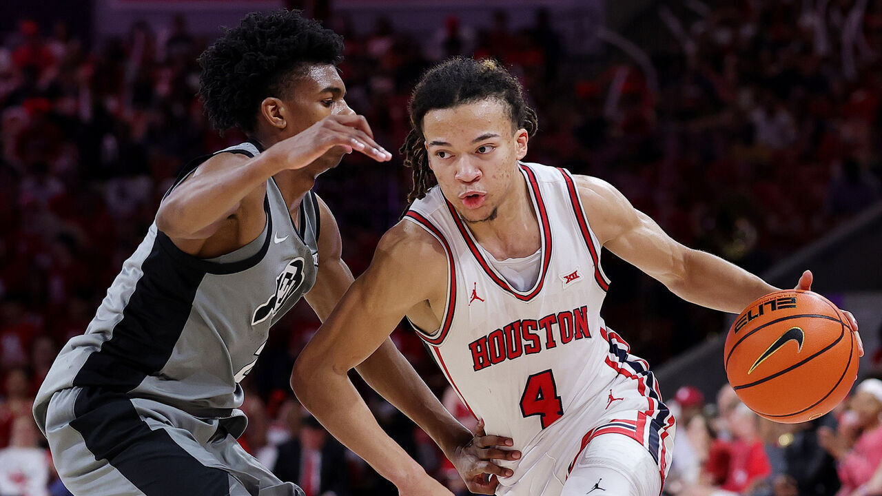 HOUSTON, TEXAS - FEBRUARY 28: Kingston Flemings #4 of the Houston Cougars drives against Isaiah Johnson #2 of the Colorado Buffaloes during the second half at Fertitta Center on February 28, 2026 in Houston, Texas.