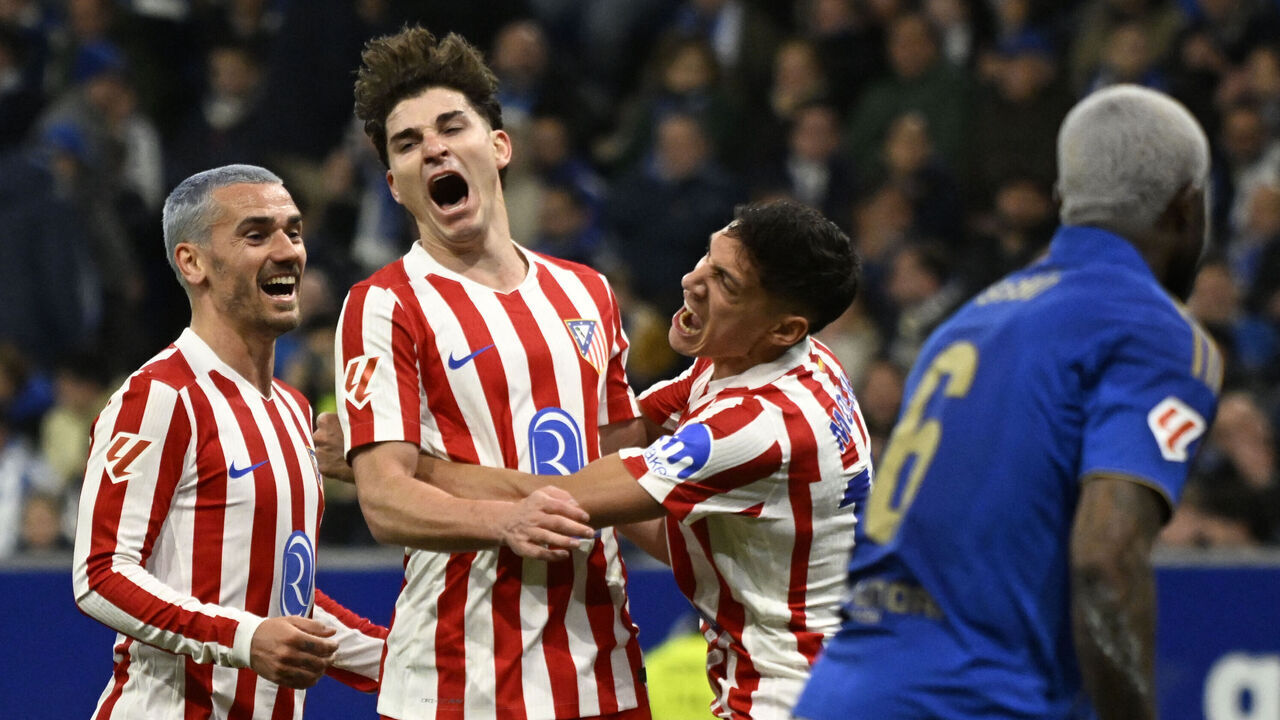 TOPSHOT - Atletico Madrid's Argentine forward #19 Julian Alvarez (C) celebrates with teammates French forward #07 Antoine Griezmann (L) and Argentine defender #16 Nahuel Molina Lucero after scoring a goal during the Spanish league football match between Real Oviedo and Club Atletico de Madrid at Carlos Tartiere Stadium in Oviedo on February 28, 2026.