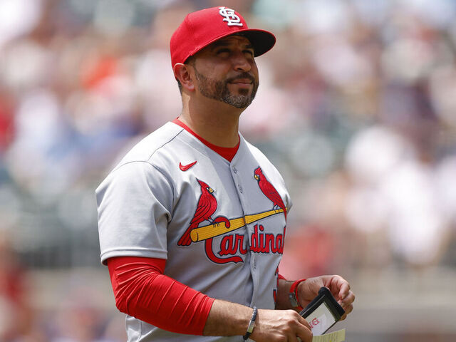 ATLANTA, GEORGIA - APRIL 23: Manager Oliver Marmol of the St. Louis Cardinals makes a pitching change during the seventh inning against the Atlanta Braves at Truist Park on April 23, 2025 in Atlanta, Georgia.
