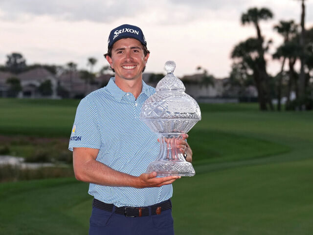 PALM BEACH GARDENS, FLORIDA - MARCH 01: Nico Echavarria of Colombia poses with the winner's trophy after winning the the Cognizant Classic 2026 at PGA National Resort And Spa on March 01, 2026 in Palm Beach Gardens, Florida.