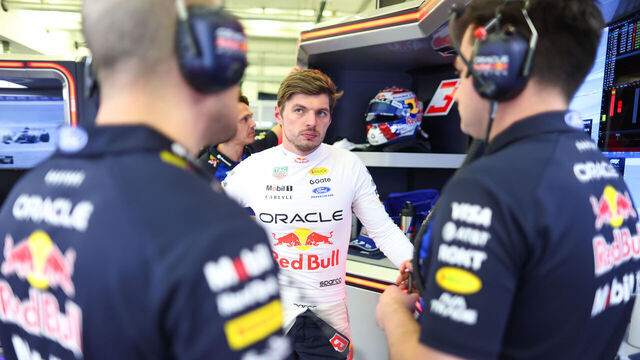 BAHRAIN, BAHRAIN - FEBRUARY 19: Max Verstappen of the Netherlands and Oracle Red Bull Racing talks with his engineers in the garage during day two of F1 Testing at Bahrain International Circuit on February 19, 2026 in Bahrain, Bahrain.
