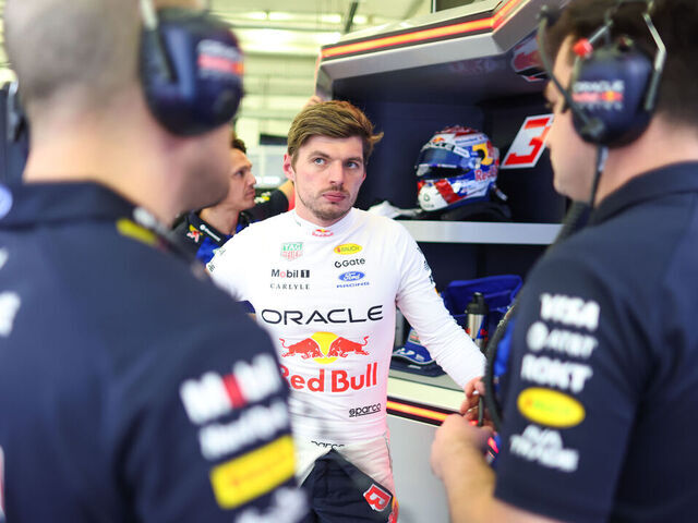 BAHRAIN, BAHRAIN - FEBRUARY 19: Max Verstappen of the Netherlands and Oracle Red Bull Racing talks with his engineers in the garage during day two of F1 Testing at Bahrain International Circuit on February 19, 2026 in Bahrain, Bahrain.