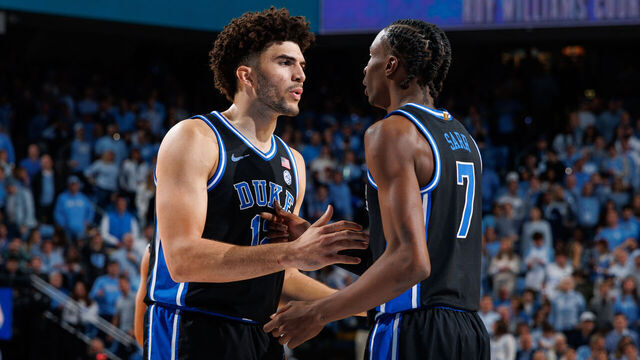 CHAPEL HILL, NC - FEBRUARY 07: Cameron Boozer #12 of the Duke Blue Devils talks to teammate Dame Sarr #7 during a game against the North Carolina Tar Heels on February 07, 2026 at the Dean Smith Center in Chapel Hill, North Carolina. North Carolina won 71-68.