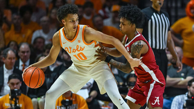 KNOXVILLE, TN - FEBRUARY 28: Tennessee Volunteers forward Nate Ament (10) controls the ball against Alabama Crimson Tide guard Aden Holloway (2) during the college basketball game between the Tennessee Volunteers and the Alabama Crimson Tide on February 28, 2026, at Food City Center in Knoxville, TN.