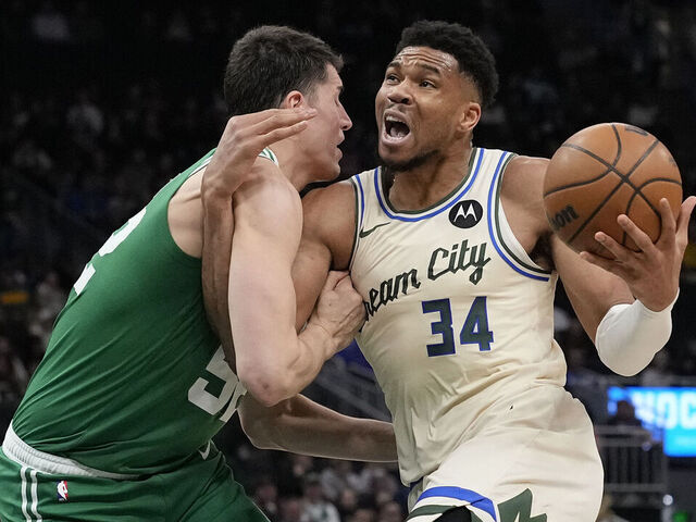 MILWAUKEE, WISCONSIN - MARCH 02: Giannis Antetokounmpo #34 of the Milwaukee Bucks dribbles the ball against Luka Garza #52 of the Boston Celtics during the second quarter at Fiserv Forum on March 02, 2026 in Milwaukee, Wisconsin.