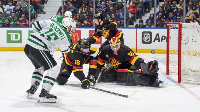 VANCOUVER, CANADA - MARCH 2: Colin Blackwell #15 of the Dallas Stars scores on Nikita Tolopilo #60 of the Vancouver Canucks during the third period of their NHL game at Rogers Arena on March 2, 2026 in Vancouver, British Columbia, Canada.