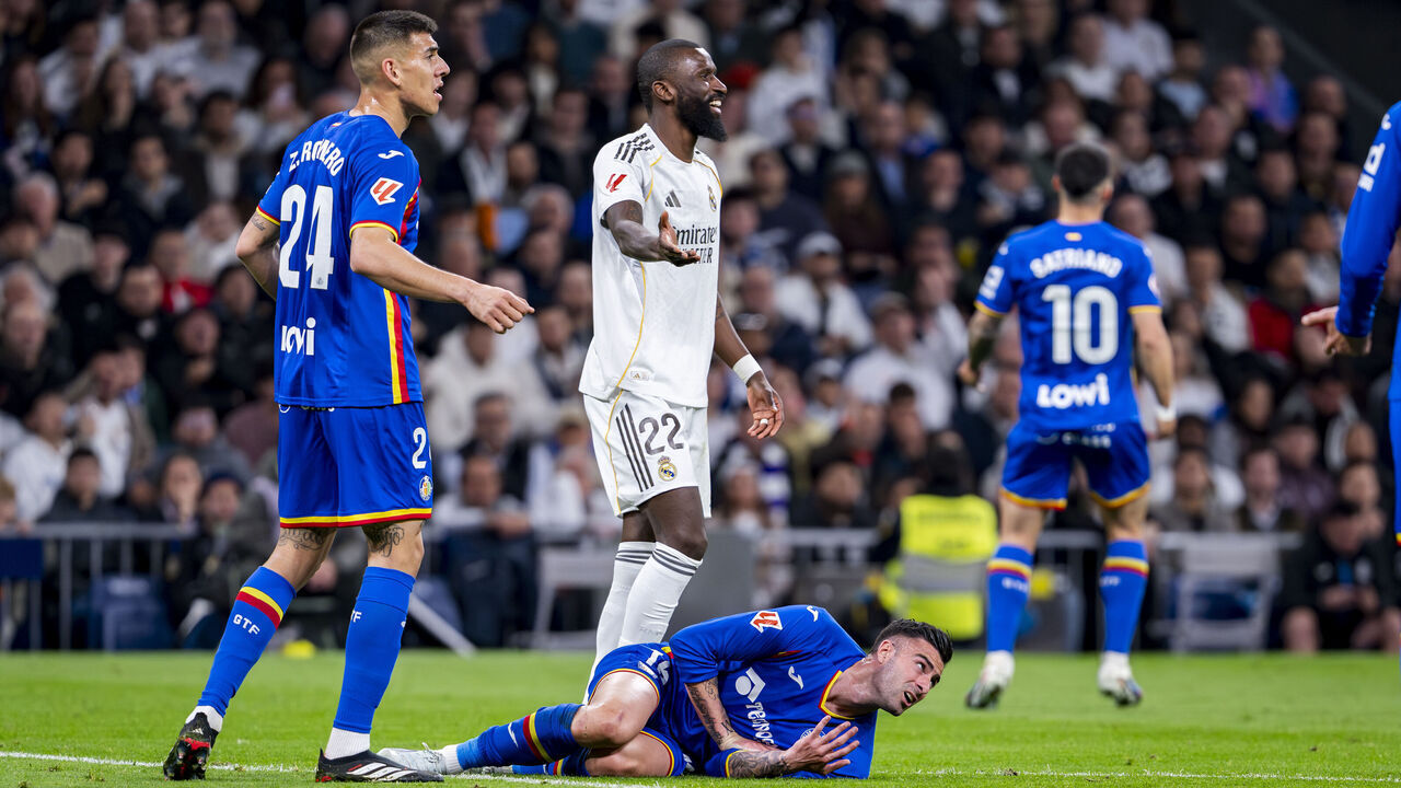 MADRID, SPAIN - MARCH 2: Diego Rico of Getafe CF (R) is seen on the ground after receiving a foul from Antonio Rudiger of Real Madrid (L) during the LaLiga EA Sports match between Real Madrid CF and Getafe CF at Estadio Santiago Bernabeu on March 2, 2026 in Madrid, Spain.