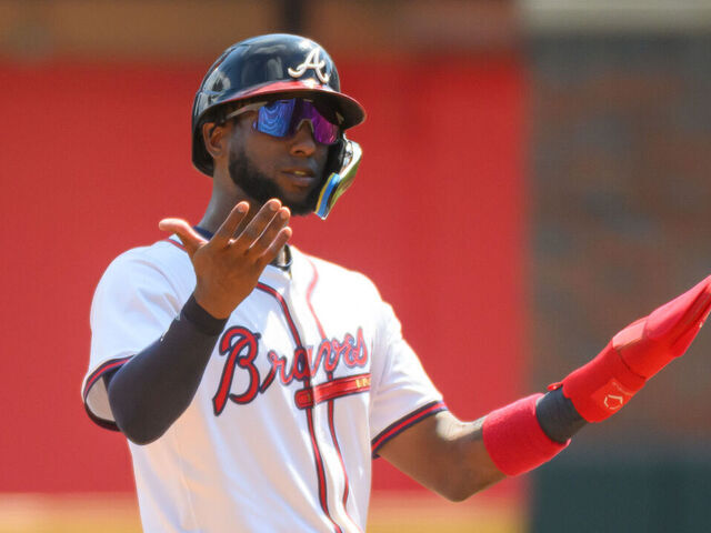 ATLANTA, GEORGIA - SEPTEMBER 14: Jurickson Profar #7 of the Atlanta Braves gestures from second base in the fifth inning of a game against the Houston Astros at Truist Park on September 14, 2025 in Atlanta, Georgia.