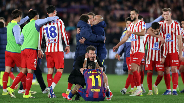 Atletico Madrid's Argentine coach Diego Simeone (C) conforts Barcelona's Brazilian forward #11 Raphinha at the end of the Copa del Rey (King's Cup) semi final second leg football match between FC Barcelona and Club Atletico de Madrid at Camp Nou Stadium in Barcelona on March 3, 2026.