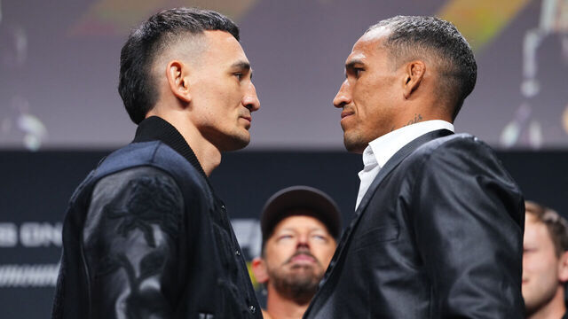 LAS VEGAS, NEVADA - DECEMBER 05: (L-R) Opponents Max Holloway and Charles Oliveira face off during the UFC It's On Seasonal Press Conference at T-Mobile Arena on December 05, 2025 in Las Vegas, Nevada.