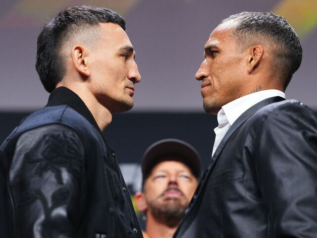 LAS VEGAS, NEVADA - DECEMBER 05: (L-R) Opponents Max Holloway and Charles Oliveira face off during the UFC It's On Seasonal Press Conference at T-Mobile Arena on December 05, 2025 in Las Vegas, Nevada.