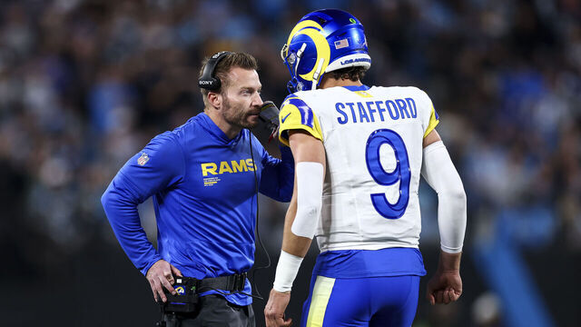 CHARLOTTE, NORTH CAROLINA - JANUARY 10: Head coach Sean McVay of the Los Angeles Rams talks with Matthew Stafford #9 during the second quarter of an NFL wild card playoff game against the Carolina Panthers at Bank of America Stadium on January 10, 2026 in Charlotte, North Carolina.