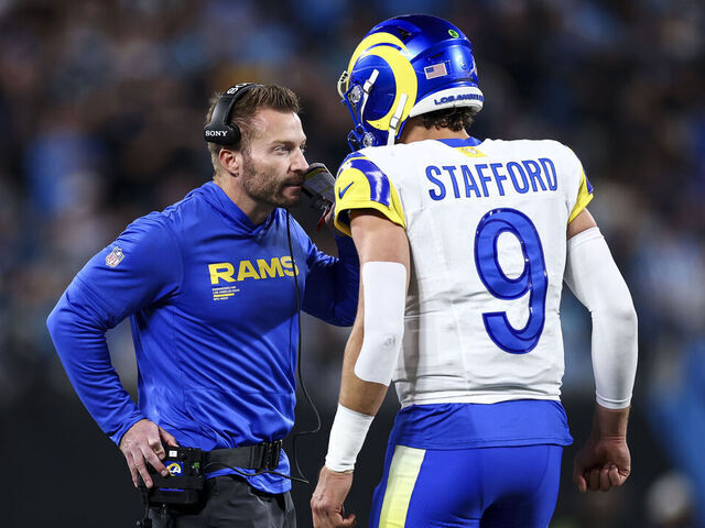 CHARLOTTE, NORTH CAROLINA - JANUARY 10: Head coach Sean McVay of the Los Angeles Rams talks with Matthew Stafford #9 during the second quarter of an NFL wild card playoff game against the Carolina Panthers at Bank of America Stadium on January 10, 2026 in Charlotte, North Carolina.