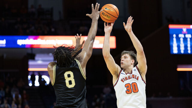 CHARLOTTESVILLE, VIRGINIA - MARCH 3: Dallin Hall #30 of the Virginia Cavaliers shoots over Mekhi Mason #8 of the Wake Forest Demon Deacons in the second half at John Paul Jones Arena on March 3, 2026 in Charlottesville, Virginia.