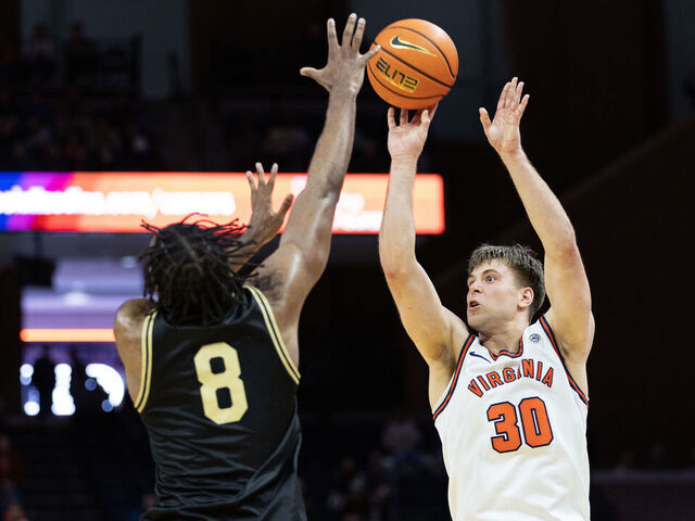 CHARLOTTESVILLE, VIRGINIA - MARCH 3: Dallin Hall #30 of the Virginia Cavaliers shoots over Mekhi Mason #8 of the Wake Forest Demon Deacons in the second half at John Paul Jones Arena on March 3, 2026 in Charlottesville, Virginia.