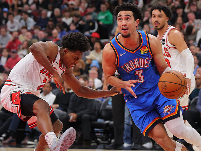 CHICAGO, IL - MARCH 03: Jared McCain #3 of the Oklahoma City Thunder drives to the basket past Collin Sexton #2 of the Chicago Bulls during the first half on March 3, 2026 at the United Center in Chicago, Illinois.