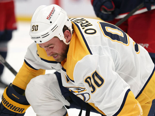 COLUMBUS, OHIO - MARCH 3: Ryan O'Reilly #90 of the Nashville Predators gets up off of the ice after sustaining an injury to his eye during the third period of the game against the Columbus Blue Jackets at Nationwide Arena on March 3, 2026 in Columbus, Ohio. Columbus defeated Nashville 3-2.
