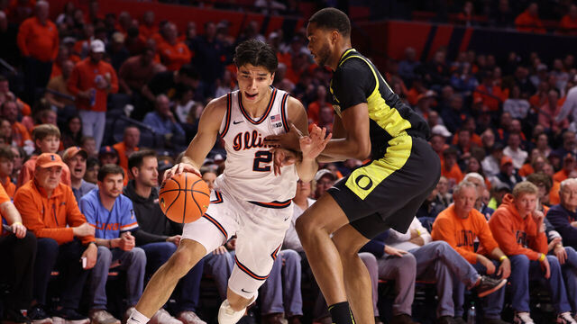 CHAMPAIGN, ILLINOIS - MARCH 3: Andrej Stojakovic #2 of the Illinois Fighting Illini drives past Kwame Evans Jr. #10 of the Oregon Ducks during the first half at State Farm Center on March 3, 2026 in Champaign, Illinois.