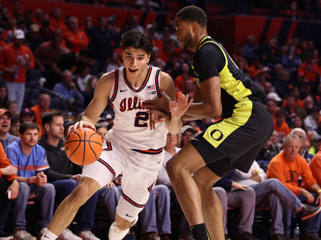 CHAMPAIGN, ILLINOIS - MARCH 3: Andrej Stojakovic #2 of the Illinois Fighting Illini drives past Kwame Evans Jr. #10 of the Oregon Ducks during the first half at State Farm Center on March 3, 2026 in Champaign, Illinois.