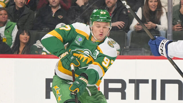 SAINT PAUL, MN - MARCH 3: Kirill Kaprizov #97 of the Minnesota Wild defends against Janis Moser #90 of the Tampa Bay Lightning during the game at Grand Casino Arena on March 3, 2026 in Saint Paul, Minnesota.