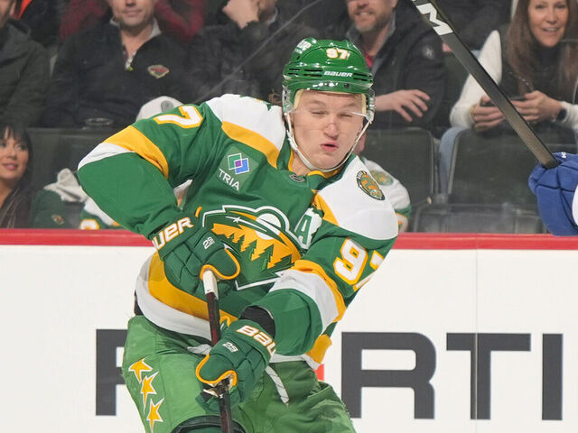 SAINT PAUL, MN - MARCH 3: Kirill Kaprizov #97 of the Minnesota Wild defends against Janis Moser #90 of the Tampa Bay Lightning during the game at Grand Casino Arena on March 3, 2026 in Saint Paul, Minnesota.