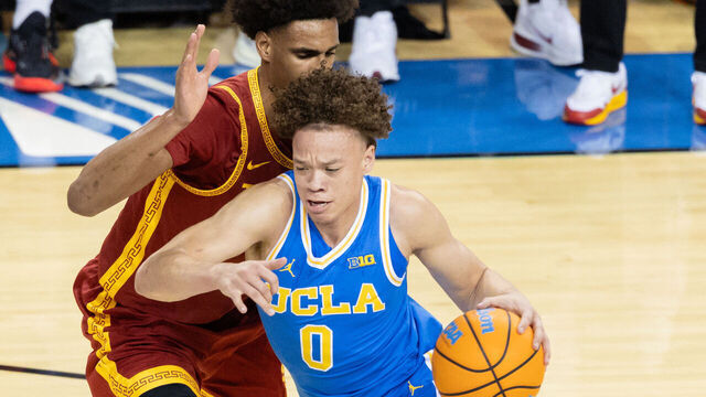 LOS ANGELES, CALIFORNIA - FEBRUARY 24: Trent Perry #0 of the UCLA Bruins drives towards the basket during the first half of a game against the USC Trojans at Pauley Pavilion on February 24, 2026 in Los Angeles, California.