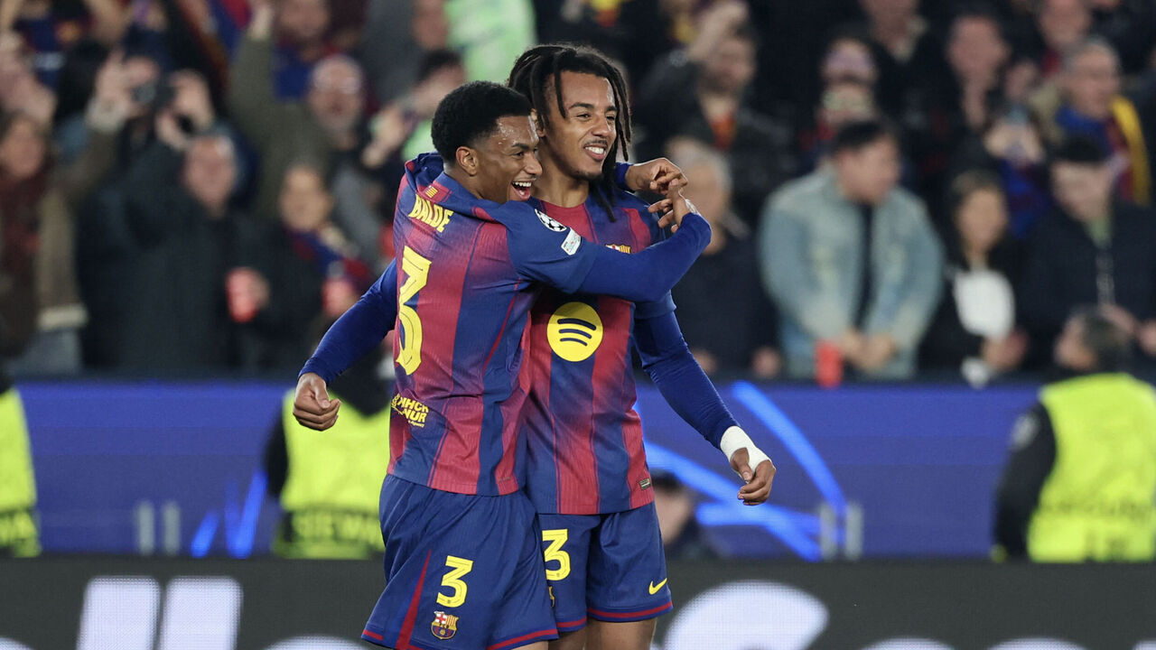 Barcelona's French defender #23 Jules Kounde (R) celebrates scoring his team's second goal with Barcelona's Spanish defender #03 Alex Balde during the UEFA Champions League league phase day 6 football match between FC Barcelona and Eintracht Frankfurt at Camp Nou Stadium in Barcelona on December 9, 2025.