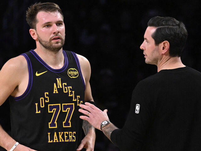 Los Angeles, CA - November 18: Head coach JJ Redick speaks with Luka Doncic #77 of the Los Angeles Lakers against the Utah Jazz in the first half of a NBA basketball game at Crypto.com Arena in Los Angeles on Tuesday, November 18, 2025.