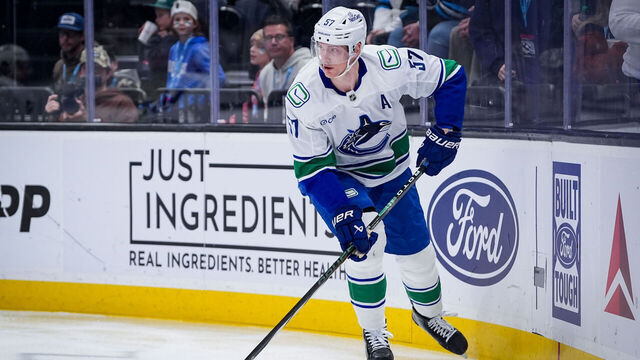 SALT LAKE CITY, UTAH - FEBRUARY 02: Tyler Myers #57 of the Vancouver Canucks skates with the puck during the first period against the Utah Mammoth at Delta Center on February 02, 2026 in Salt Lake City, Utah.