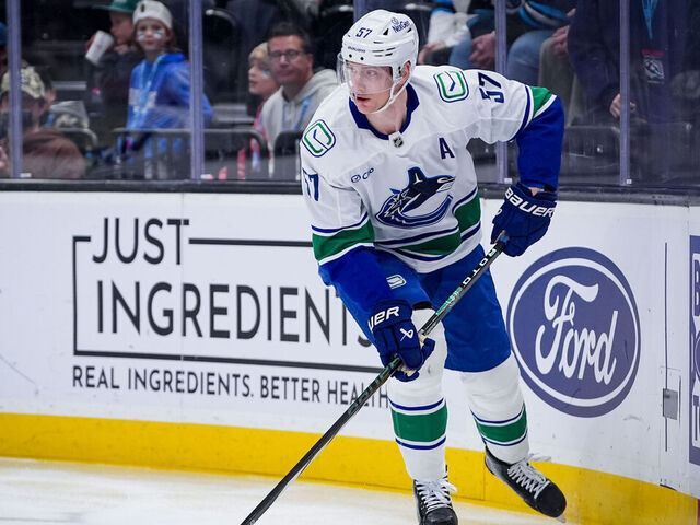 SALT LAKE CITY, UTAH - FEBRUARY 02: Tyler Myers #57 of the Vancouver Canucks skates with the puck during the first period against the Utah Mammoth at Delta Center on February 02, 2026 in Salt Lake City, Utah.