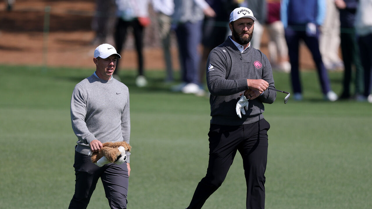 AUGUSTA, GEORGIA - APRIL 09: (L-R) Rory McIlroy of Northern Ireland and Jon Rahm of Spain walk on the second hole during a practice round prior to the 2025 Masters Tournament at Augusta National Golf Club on April 09, 2025 in Augusta, Georgia.