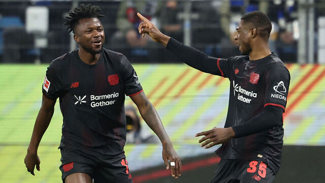 Bayer Leverkusen's Cameroonian forward #35 Christian Kofane (R) celebrates scoring the opening goal with his teammates during the German first division Bundesliga football match between Hamburger SV and Bayer 04 Leverkusen in Hamburg, northern Germany on March 4, 2026. / DFL REGULATIONS PROHIBIT ANY USE OF PHOTOGRAPHS AS IMAGE SEQUENCES AND/OR QUASI-VIDEO