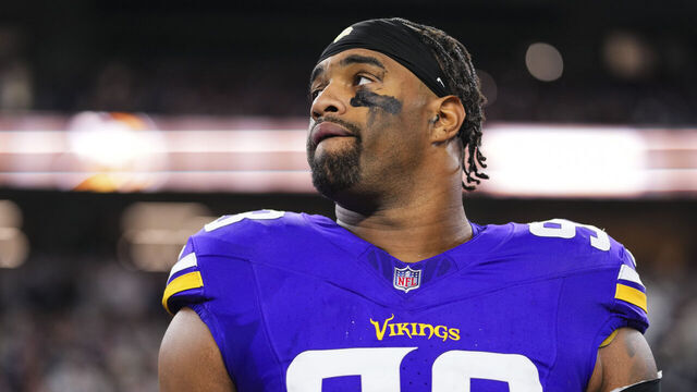 ARLINGTON, TX - DECEMBER 14: Jonathan Allen #93 of the Minnesota Vikings looks on from the sideline during the national anthem prior to an NFL football game against the Dallas Cowboys at AT&T Stadium on December 14, 2025 in Arlington, Texas.